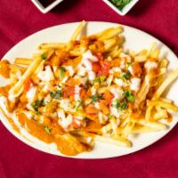 Masala Fries · Homemade fries topped with masala sauce, onion, tomato, cream and garnished with cilantro.