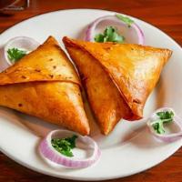 Meat Samosa · Flour tortillas stuffed with minced chicken or lamb, peas, onions, herbs and spices deep-fri...