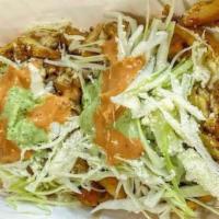 Pollo Asado Sope · Grilled chicken. A thick patty tortilla filled with refried beans, cabbage and cotija cheese.