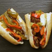 Philly Cheesesteak · Sliced steak, grilled peppers & onion, provolone, mayo, baguette.