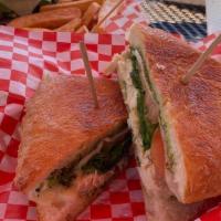 Paninis Chicken Pesto · Grilled chicken, tomato, spinach, mozzarella cheese, & pesto sauce pressed within a ciabatta...