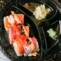 Kings Roll · Snow crab, d.f shrimp topped with salmon, tuna, tobiko and special sauce.