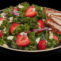 Kale Salad With Strawberries · Kale salad with balsamic vinaigrette dressing, strawberries, red onion, feta cheese, and sli...