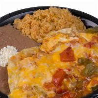 Huevos Rancheros · 2 over easy eggs, on top of 2 tortillas showered with bell pepper, tomatoes and onions, rice...