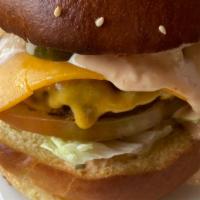 Breakaway Burger · Grass- Fed Beef Patty, Cheddar Cheese, Lettuce, Pickles, Secret Sauce, Brioche Bun.