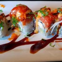 Cherry Blossom (Spicy) · IN: shrimp tempura, crab meat, avocado
OUT: spicy tuna, green onion, masago, eel sauce, spic...
