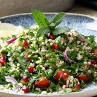 Tabouli · Chopped parsley, tomatoes, onions, lemon juice, cracked wheat and olive oil.