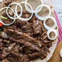 Beef Shawarma Plate · Thinly carved marinated beef cooked on a vertical broiler. Served with rice, hummus, salad, ...
