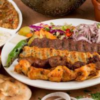 Combo Grill Plate · Combination of beef, lamb, gyro, chicken kabab and kafta kabab. Served with rice, hummus, sa...