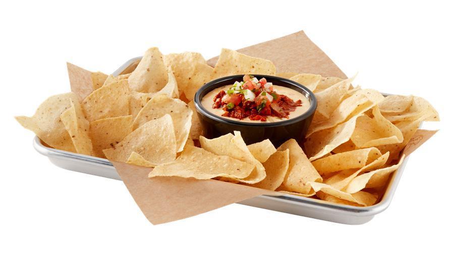 Chili Con Queso · chili / melted white cheddar / Young Guns Hatch
chiles / house-made pico de gallo / house-made tostada chips / Make it Wild™: Add a wild sauce drizzle for no charge