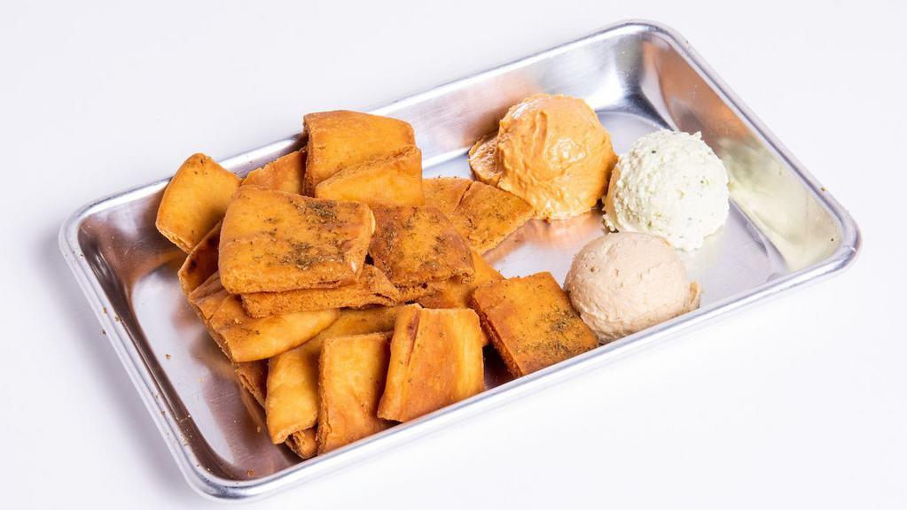 Hummus & Pita Chips · House made organic hummus served with a side of pita chips.