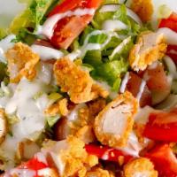 Greek Crispy Chicken Salad · Delicious Premium Quality Crispy Chicken Tenders, Mixed Greens, Secret House Dressing, Tomat...