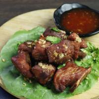 Pork Spare-Ribs · Fried marinated pork spare-ribs with garlic, black pepper and coriander root served with chi...