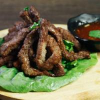 Thai Jerky [Beef] · Deep fried marinated beef served with spicy lime sauce
