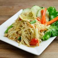 Som Tum [Thai] · Chopped green papaya mixed with green bean, tomato, garlic, carrot, peanut and spicy lime dr...