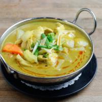 Yellow Curry · Yellow curry paste with potato, carrot, onion and green onion in coconut milk