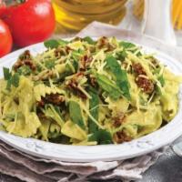 Basil Pesto Bowtie Pasta Salad · Bow tie pasta, Creamy pesto sauce,  Italian dressing,  Cheese and fresh Basil leaves