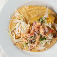 Pescado(Fish) · Battered fish with cabbage, chipotle sauce, tarter sauce and pico de gallo.