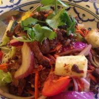 Beef Salad · Light grilled juicy tenderloin beef in a deliciously spicy dressing tossed with shallot, min...