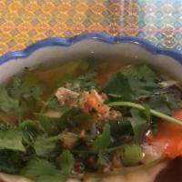 Wonton Soup · Wonton skin stuffed with minced pork in clear chicken broth with baby bok choys, topped with...