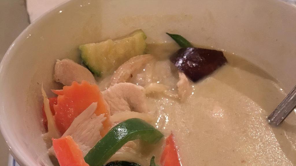Green Curry · Simmered in green curry paste in coconut milk with bamboo shoots, bell peppers eggplant, basil leaves.