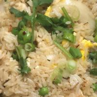 Thai Fried Rice · Stir fried rice with egg, tomatoes, onions and cucumbers.