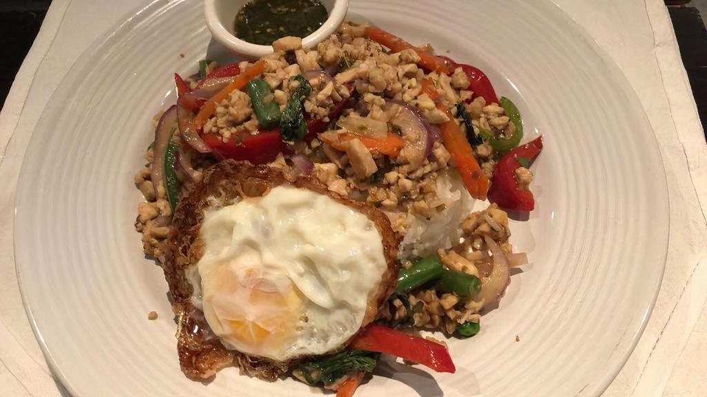 Kra Pow Gai Kai Pow · Minced chicken, basil, thai chili, garlic, onion, bell pepper fried egg and served over rice.