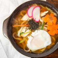 Nabeyaki Udon · In soy broth with shrimp tempura, eggs, chicken and vegetables.