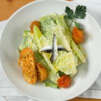 Caesar Salad · Gem lettuce, anchovies, parmesan crostinis, buttermilk dressing, blistered cherry tomatoes.