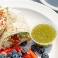 Egg White Veggie Burrito · With aged white cheddar, chipotle aioli, roasted peppers, red onion, avocado, and tomato. Se...