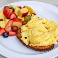 Scrambled Egg On Toast · Fresh scrambled eggs on multigrain with seasonal fruit.