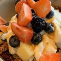 Granola Parfait · Home-made granola, fresh berries, Greek yogurt with an orange honey drizzle.