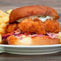 Crispy Fish Sandwich & Fries · Ale-battered wild pacific cod, shaved cabbage, pickles and tartar sauce.
