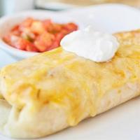Breakfast Burrito · Scrambled eggs, bacon, cheese, hash brown and 2 buttermilk pancakes.