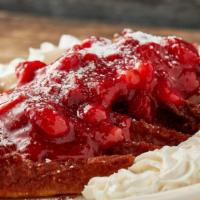 Deep-Fried Strawberry French Toast · 3 slices of deep-fried texas toast topped with strawberry sauce and whip cream. Served with ...