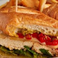 Grilled Chicken Pesto Sandwich · Grilled chicken breast served with spring mix, roasted sweet red peppers, pesto, on a Parmes...