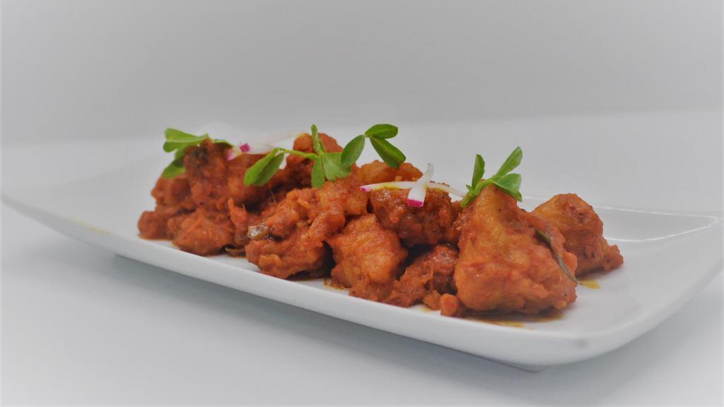 Chicken 65 · Unique dish made with ginger, cayenne pepper and lime that has been a classic favourite to many since olden days.
