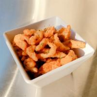 Cajun Pork Fries · Pork shreds deep fried then sprinkled with cajun seasoning to create a delightful new snack.