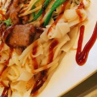 Signature Beef Chow Fun · Beef stir-fried flat rice noodle. Artfully dressed with our signature house special sauce.