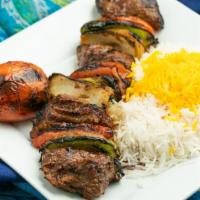 Shish Kabob · Tender chunks of marinated beef filet in between a medley of onions, green peppers and tomat...