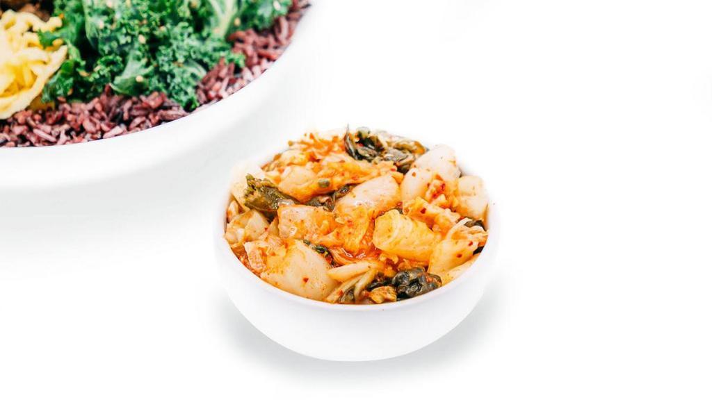 Kimchi · The powerful probiotic served on the side of most Korean meals. Low in calories and high in vitamins A,B, & C, Kimchi is the side dish that cares for your well-being.