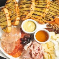 House Meat And Cheese Plate · Black truffle cheese, goat cheese, parmigiano reggiano, rosemary ham, prosciutto, spicy Ital...