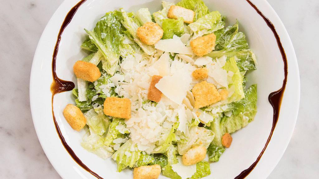 Caesar Salad · Romaine hearts, parmigiano reggiano, croutons tossed in Caesar dressing.