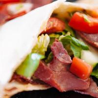 Basterma Wowshi · Thin slices of DRY CURED beef and cheese.