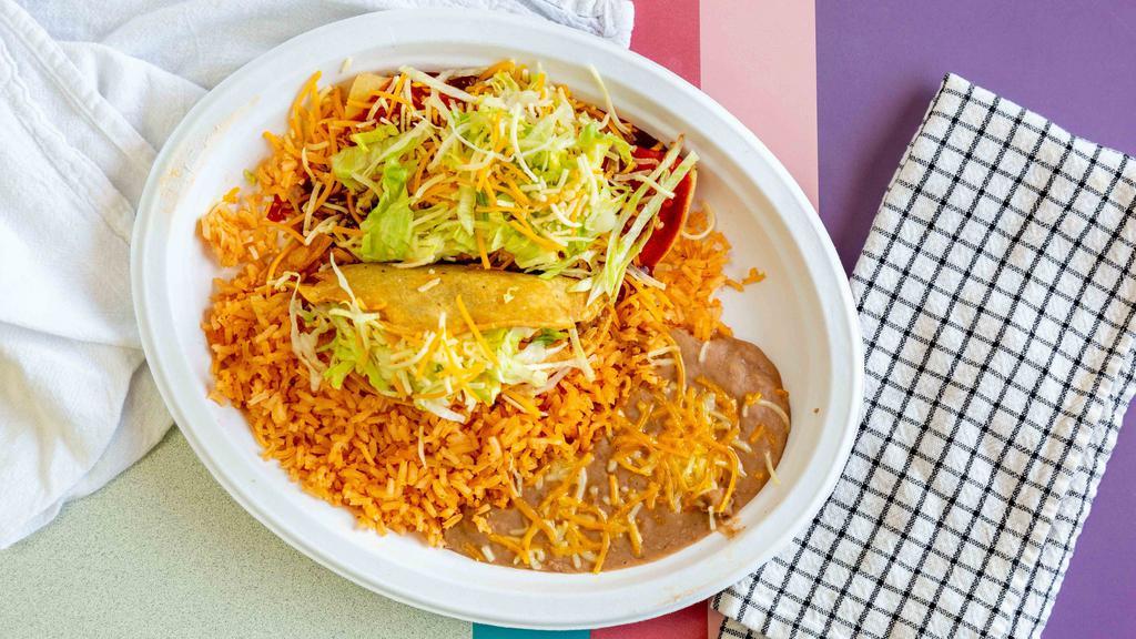 2 Enchiladas · Includes rice & beans.