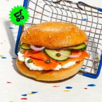 Deluxe Lox Sandwich · Savory lox with red onion, sliced cucumber and tomato, and capers on your choice of bagel.