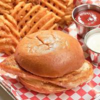 Grilled Chicken Sandwich · Our grilled chicken sandwich topped with pickles  and our signature Coop sauce all between a...