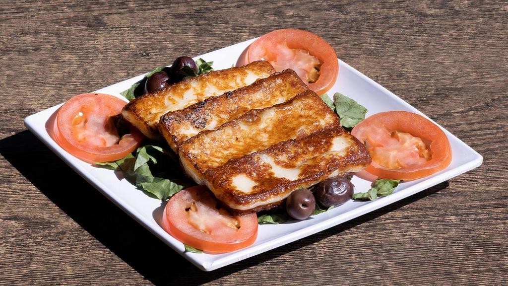 Halloumi · Pan grilled Greek cheese, sliced tomatoes
& Kalamata olives 4pcs.
