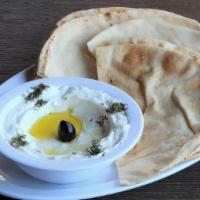 Lebni · Drained Greek yogurt topped with olives & olive oil.