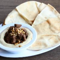 Hummus Special · Topped with sautéed beef, lamb & pine nuts.
